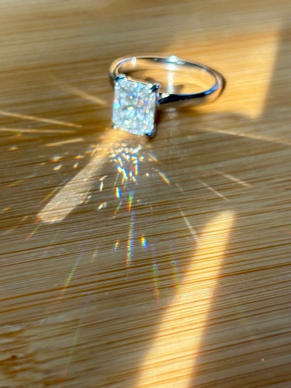 A certified 3ct radiant Moissanite solitaire in solid sterling silver and 18k!